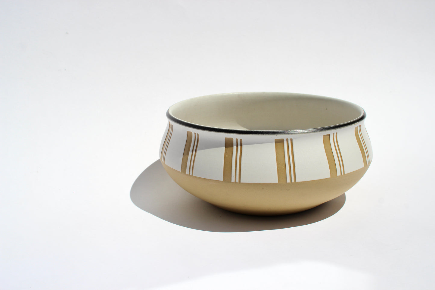 tan + cream stoneware bowl