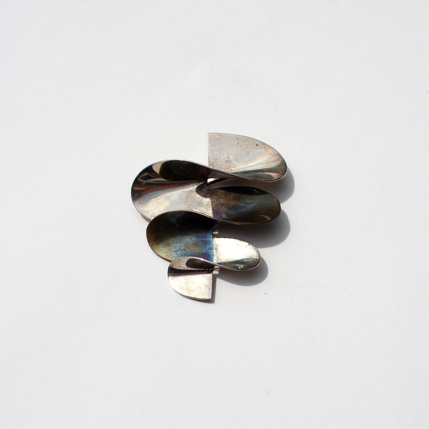 modernist silver + brass brooch
