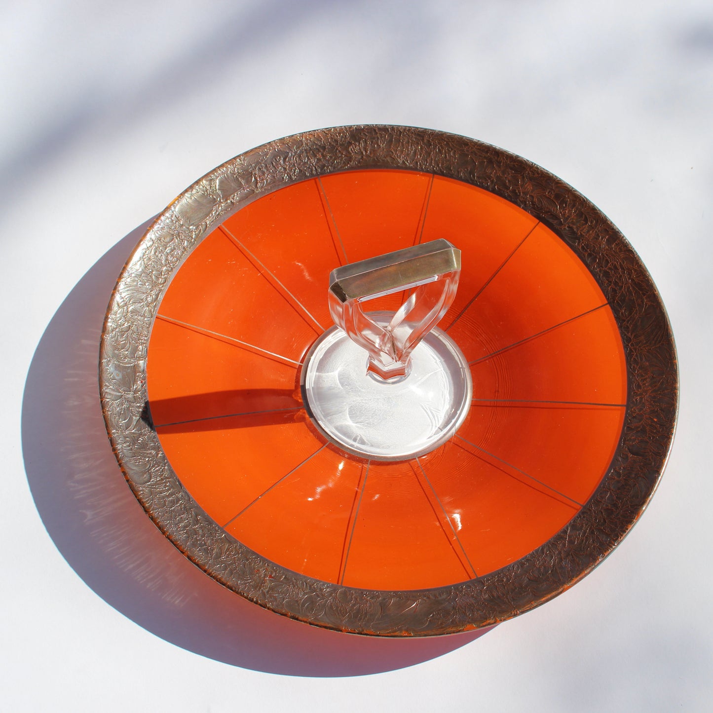brass-trimmed orange serving tray