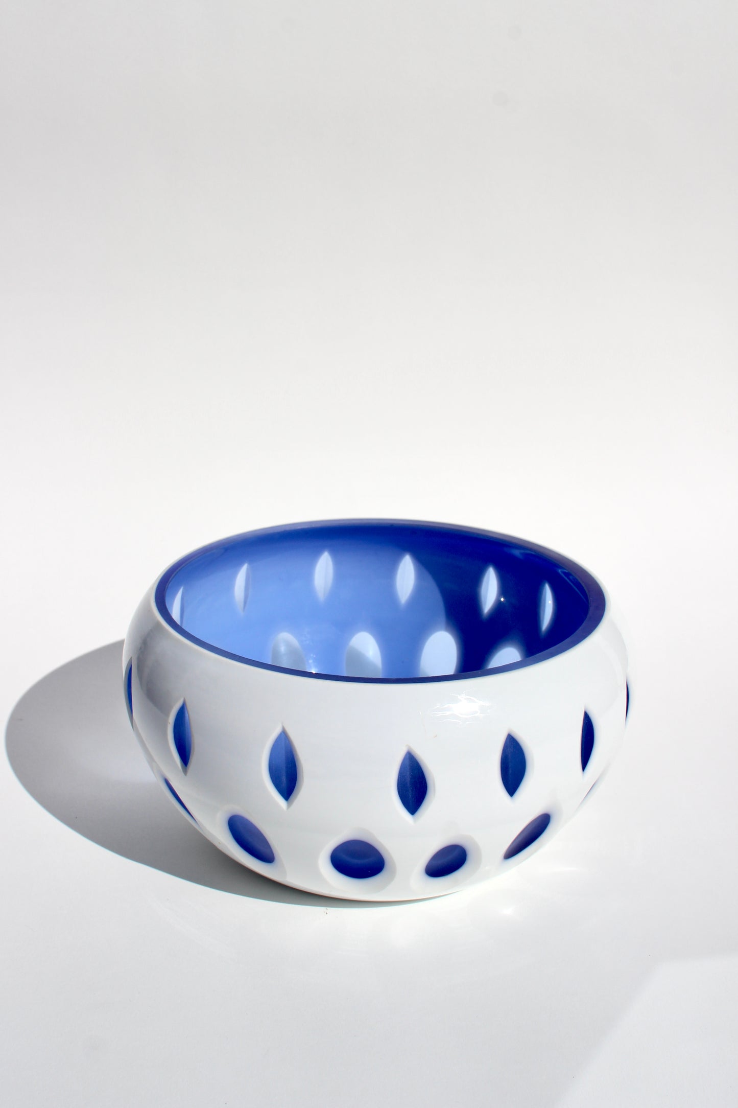 blue + white cut-out glass bowl