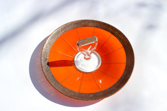 brass-trimmed orange serving tray